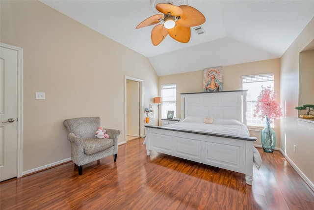 bedroom featuring vaulted ceiling, baseboards, visible vents, and dark wood-type flooring