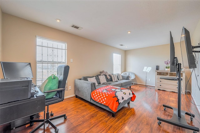 bedroom featuring recessed lighting, visible vents, baseboards, and wood finished floors