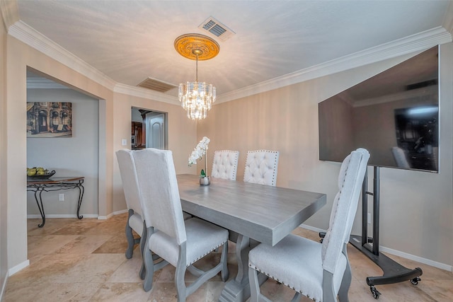 dining space featuring an inviting chandelier, crown molding, visible vents, and baseboards