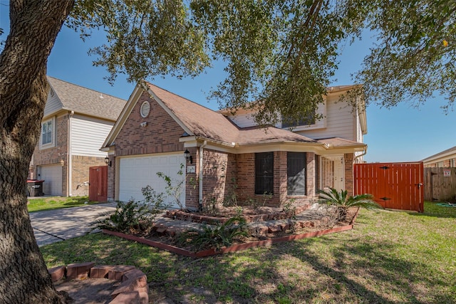 traditional-style home featuring a garage, fence, brick siding, and driveway