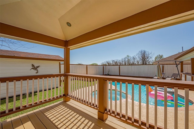 deck with a fenced in pool and a fenced backyard