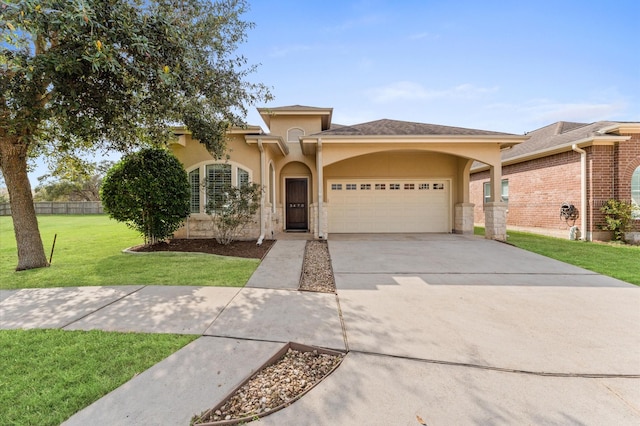 view of front of home with stucco siding, driveway, fence, an attached garage, and a front yard