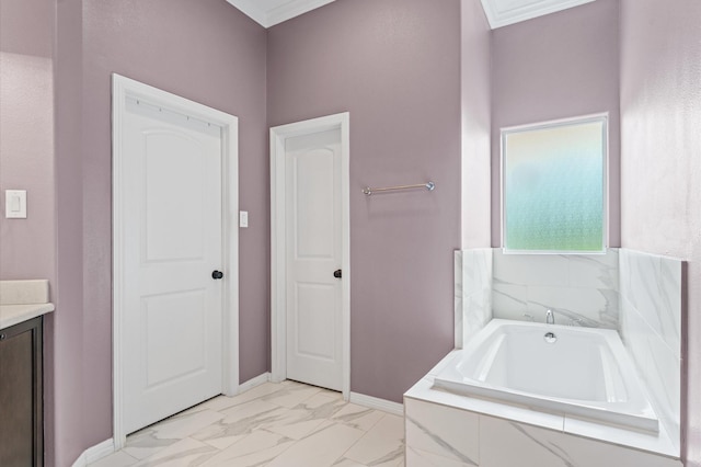 full bathroom featuring vanity, a garden tub, baseboards, and marble finish floor