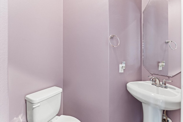 bathroom featuring a sink and toilet