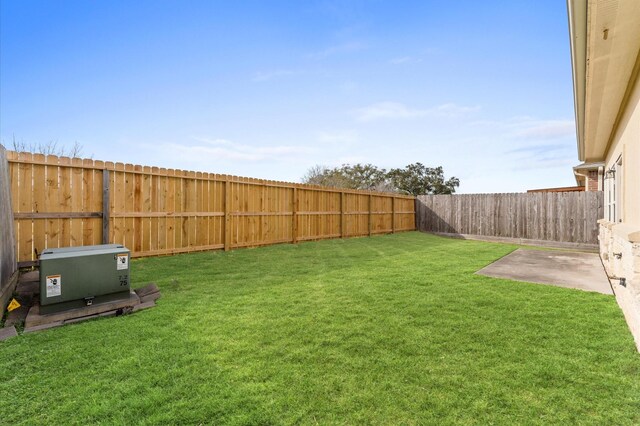 view of yard with a fenced backyard