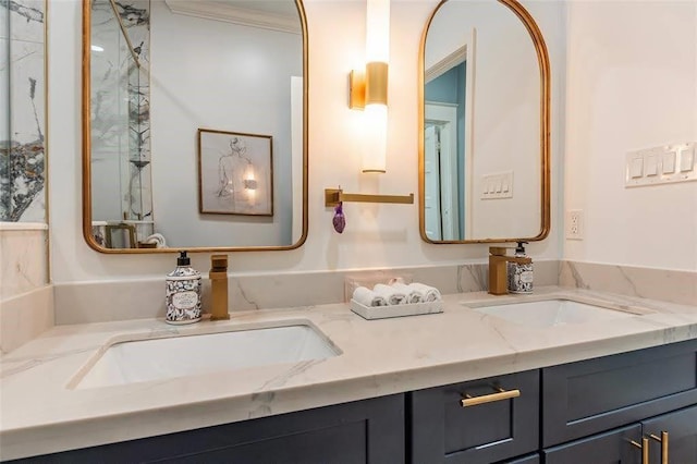 bathroom featuring a sink, ornamental molding, and double vanity