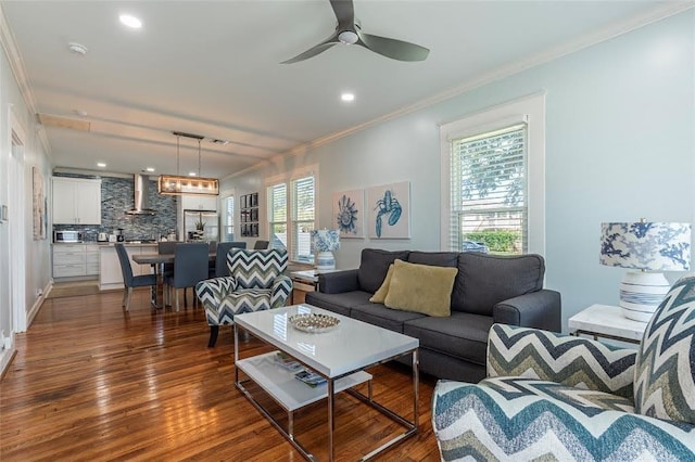 living room featuring recessed lighting, a ceiling fan, ornamental molding, and dark wood finished floors