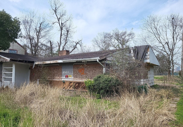 view of home's exterior featuring a chimney