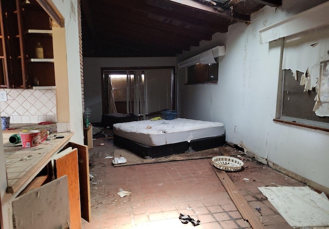 bedroom featuring lofted ceiling