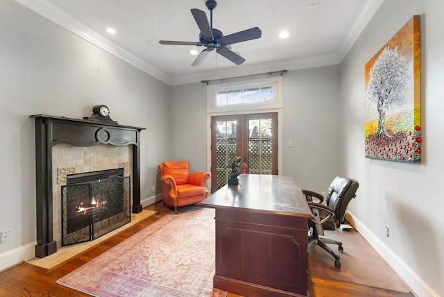 office with crown molding, wood finished floors, and french doors