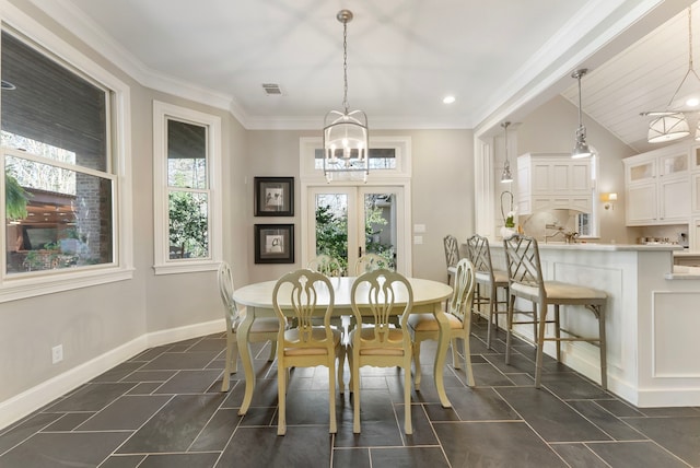 dining space featuring baseboards, visible vents, french doors, crown molding, and dark tile patterned floors