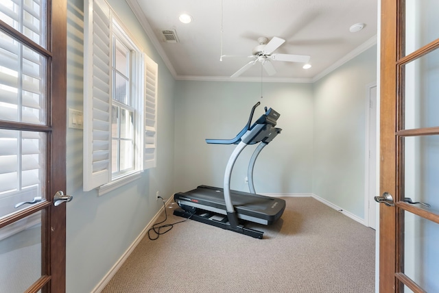 workout area with visible vents, baseboards, carpet flooring, and crown molding