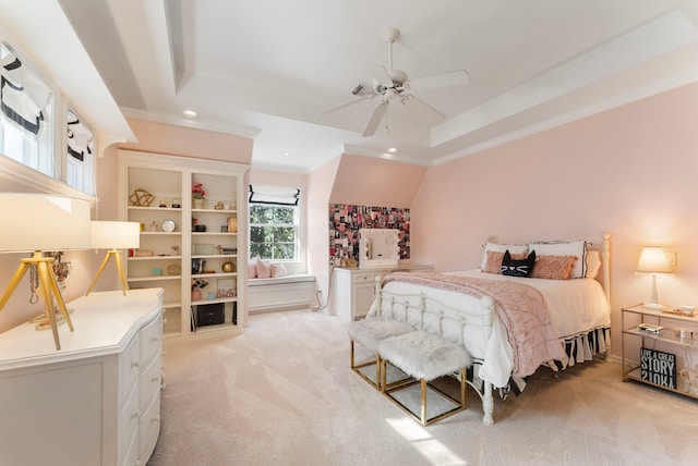 bedroom with a raised ceiling, ornamental molding, recessed lighting, and light carpet