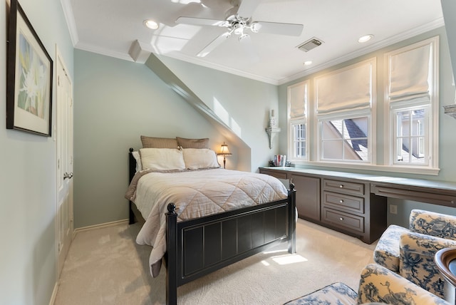 bedroom featuring ornamental molding, light colored carpet, visible vents, and built in study area