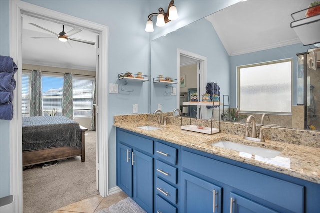 ensuite bathroom featuring double vanity, ornamental molding, ensuite bath, and a sink