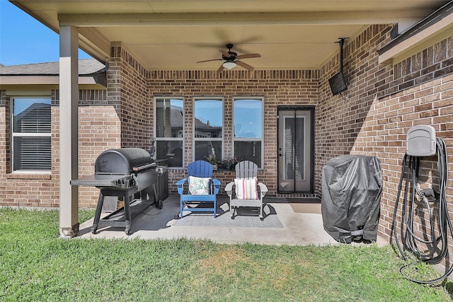 view of patio with grilling area and a ceiling fan