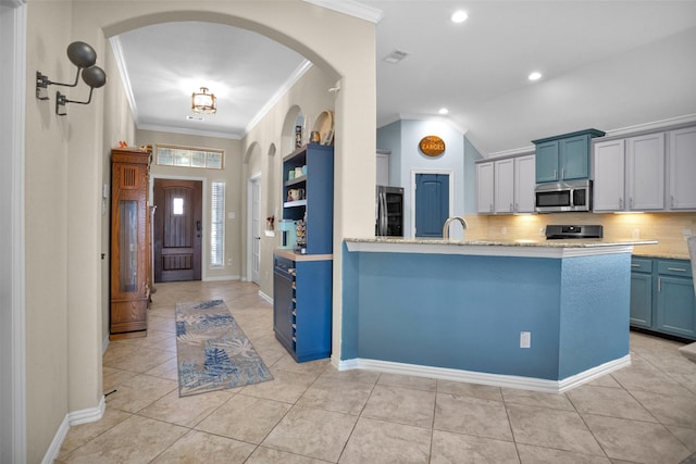 kitchen with crown molding, light tile patterned floors, visible vents, and stainless steel appliances