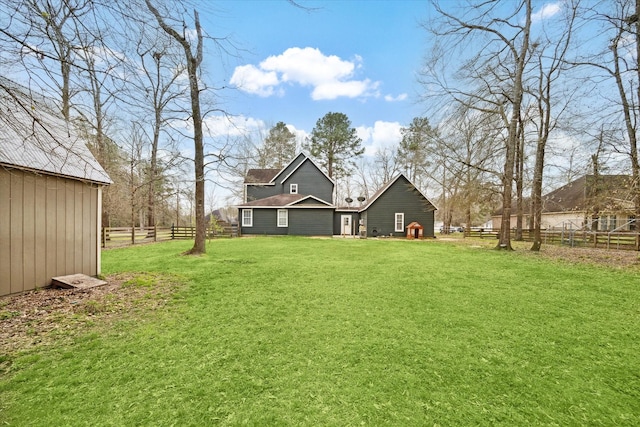 view of yard with an outbuilding and fence