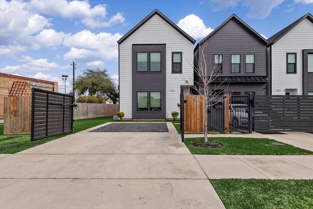 view of front of property featuring fence and a gate