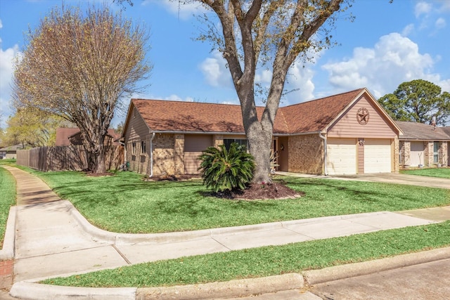 ranch-style home with brick siding, concrete driveway, and a front yard