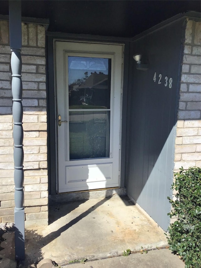 entrance to property featuring stone siding