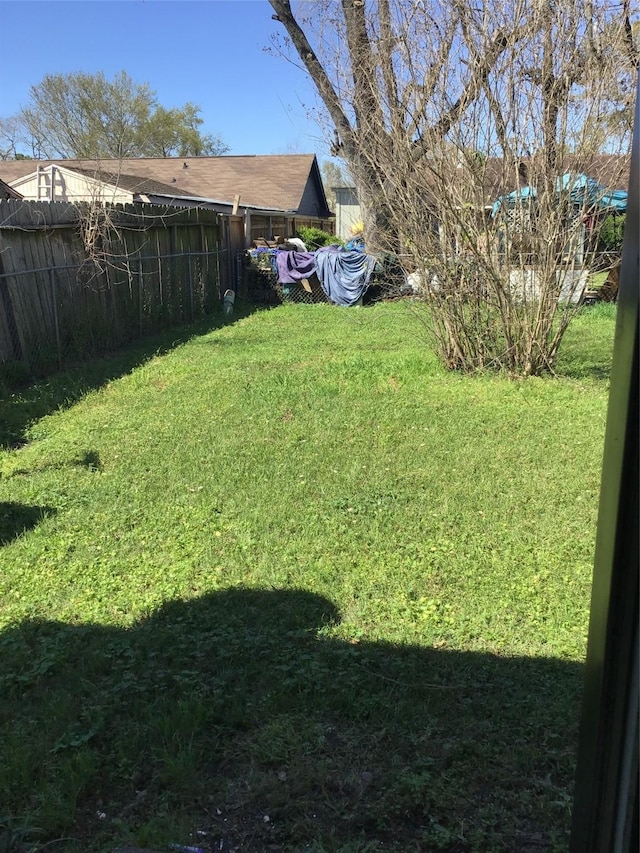 view of yard featuring fence