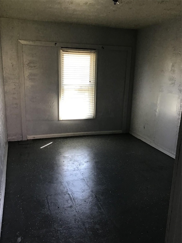 unfurnished room with tile patterned floors