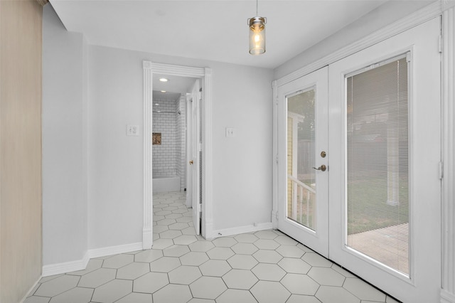 spare room with light tile patterned floors and baseboards