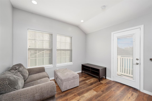 sitting room with recessed lighting, a healthy amount of sunlight, lofted ceiling, and wood finished floors