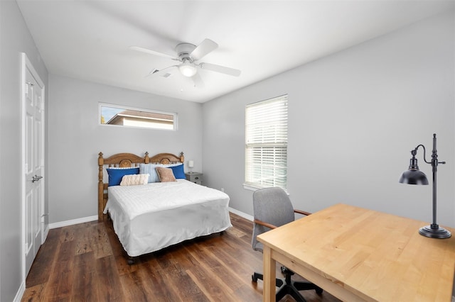 bedroom with baseboards, wood finished floors, and a ceiling fan