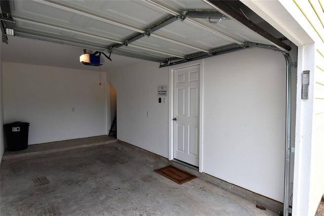 garage featuring a garage door opener