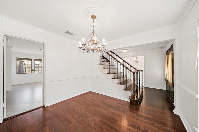 interior space featuring visible vents, crown molding, stairway, wood finished floors, and a notable chandelier