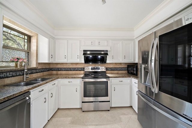 kitchen with a sink, ornamental molding, tasteful backsplash, and stainless steel appliances