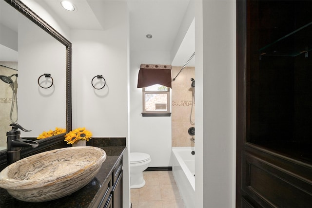 bathroom featuring tile patterned floors, toilet, recessed lighting, shower / bathing tub combination, and vanity