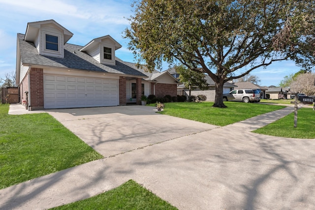 view of front facade with driveway, roof with shingles, a front lawn, a garage, and brick siding