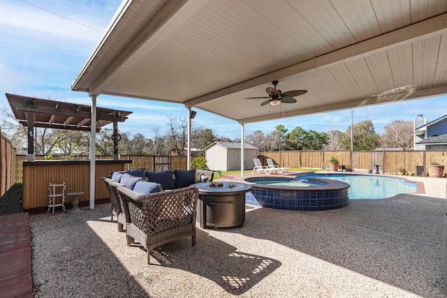 view of patio / terrace with ceiling fan, an outbuilding, a fenced backyard, and a shed