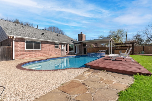 view of pool with a patio, a fenced in pool, a fenced backyard, ceiling fan, and a deck