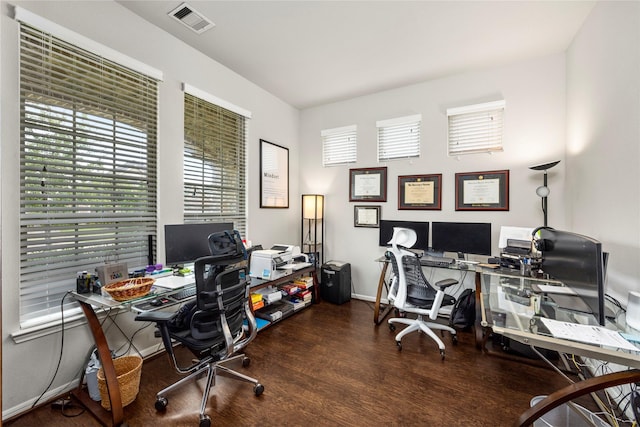 office space featuring visible vents, baseboards, and wood finished floors