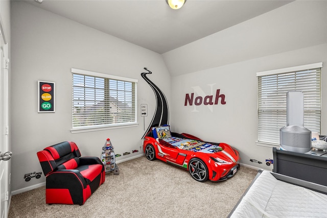 bedroom featuring carpet flooring, baseboards, and lofted ceiling