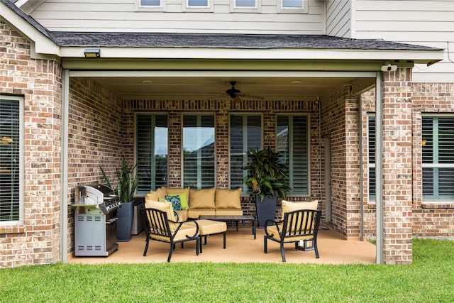 view of patio / terrace featuring area for grilling, a ceiling fan, and an outdoor hangout area