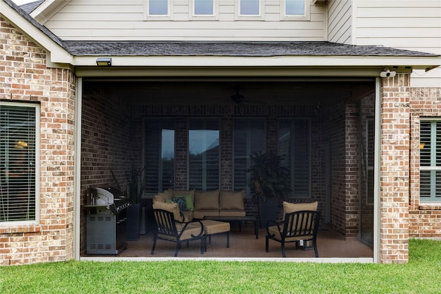 view of patio with an outdoor living space and a grill