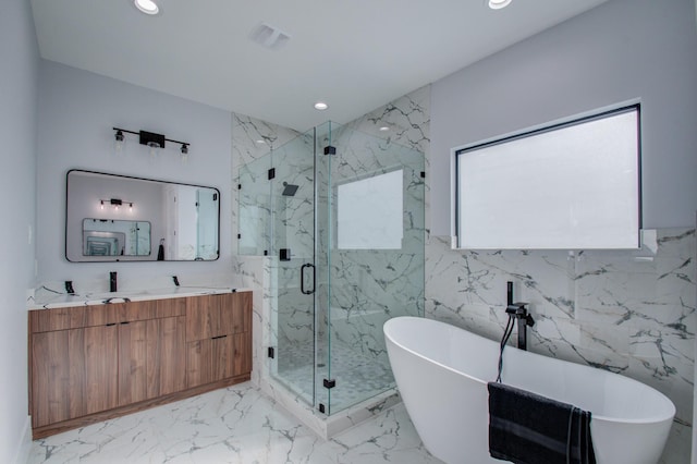 bathroom featuring a marble finish shower, a soaking tub, marble finish floor, and recessed lighting