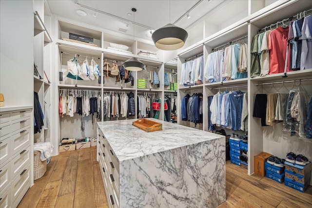 walk in closet featuring light wood-type flooring