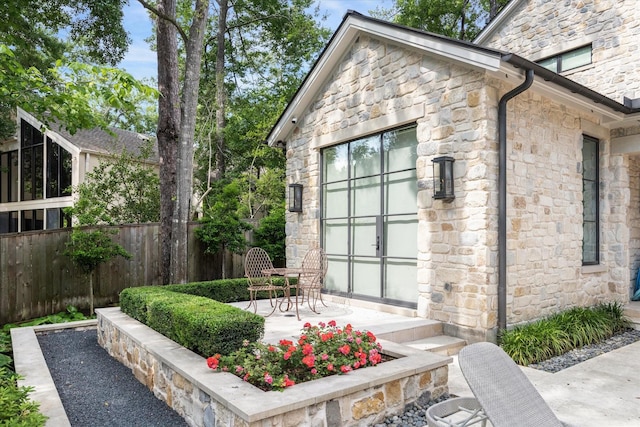 exterior space featuring a patio area and fence