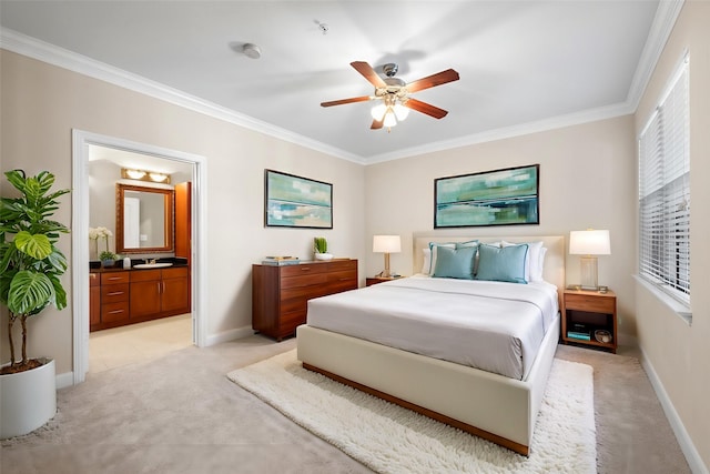 bedroom with light carpet, connected bathroom, baseboards, and ornamental molding