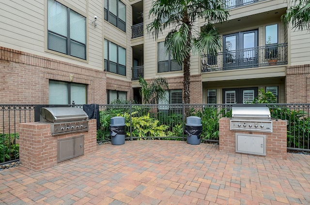 view of patio / terrace with area for grilling, fence, and grilling area