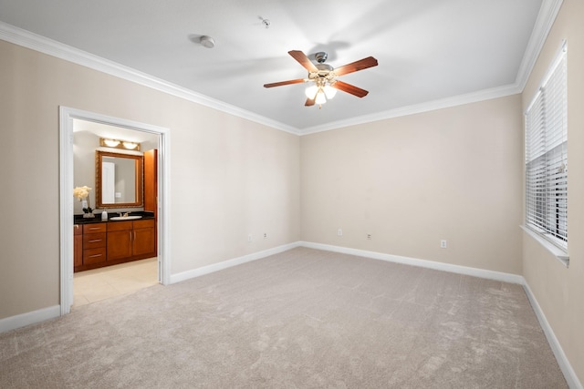 unfurnished bedroom featuring baseboards, light carpet, and ornamental molding