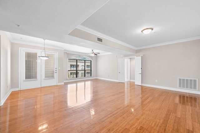 spare room with visible vents, light wood-style floors, and ceiling fan