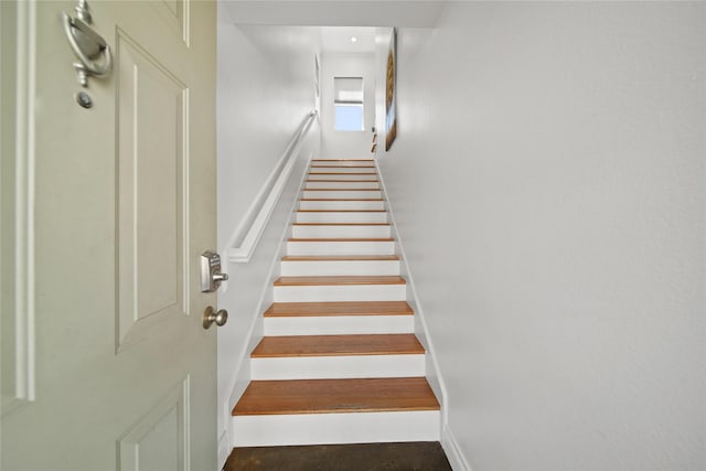 stairway with baseboards