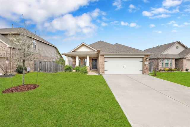 view of front of house featuring fence, an attached garage, a front lawn, concrete driveway, and brick siding